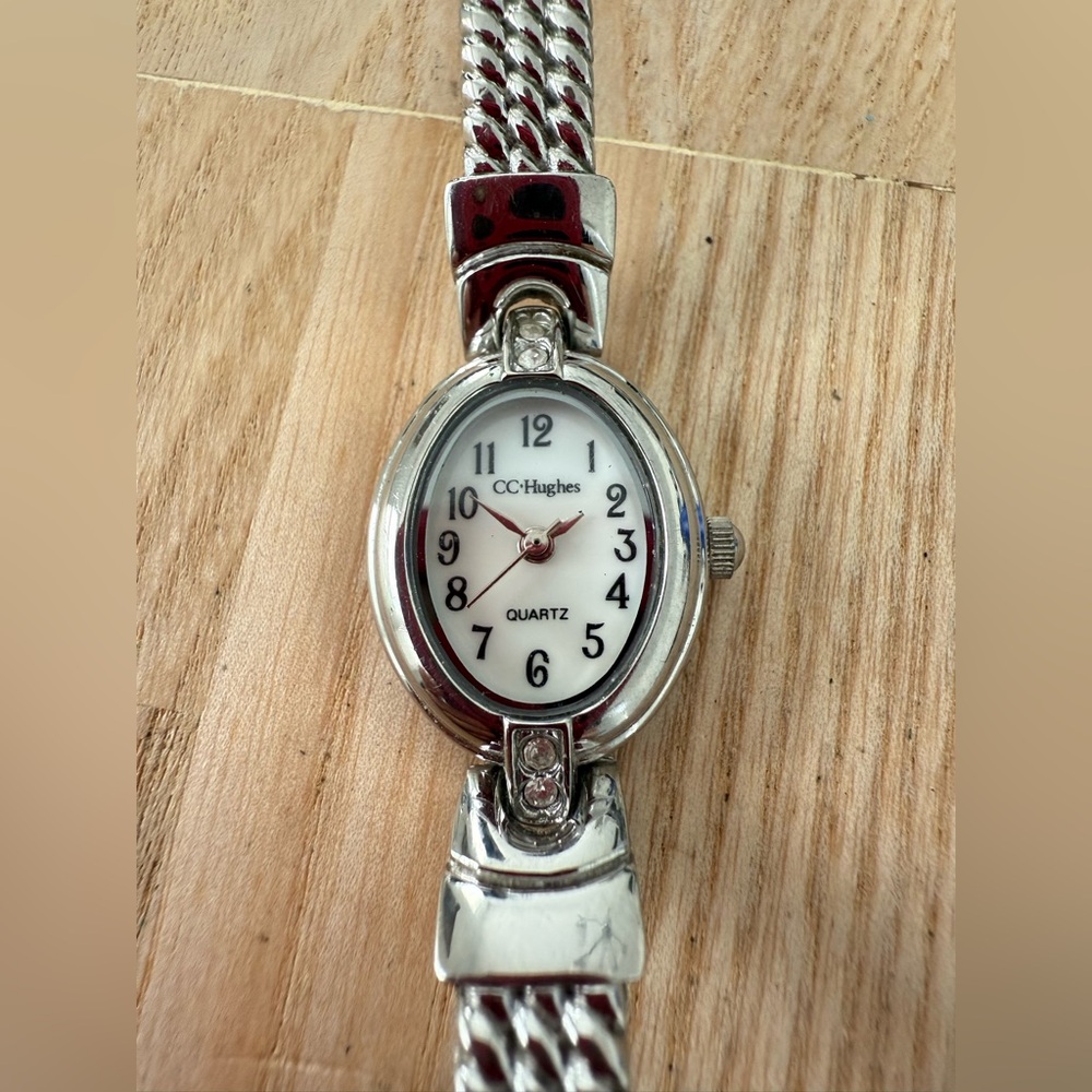 CC Hughes ladies oval silver tone watch NEW BATTERY